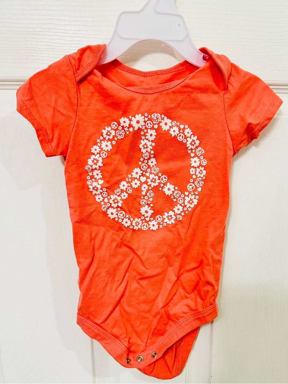 One Piece Bodysuit with White Floral Peace Sign - pink